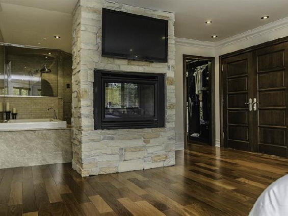 Brick wall divider with built in fireplace